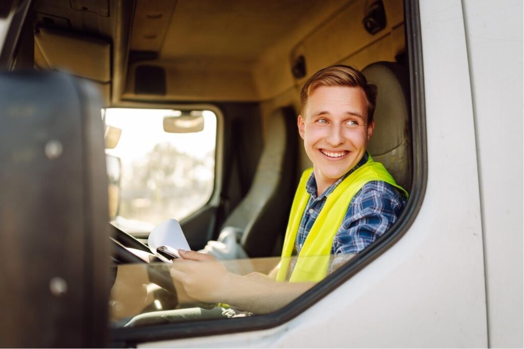 Driver smiling Canva